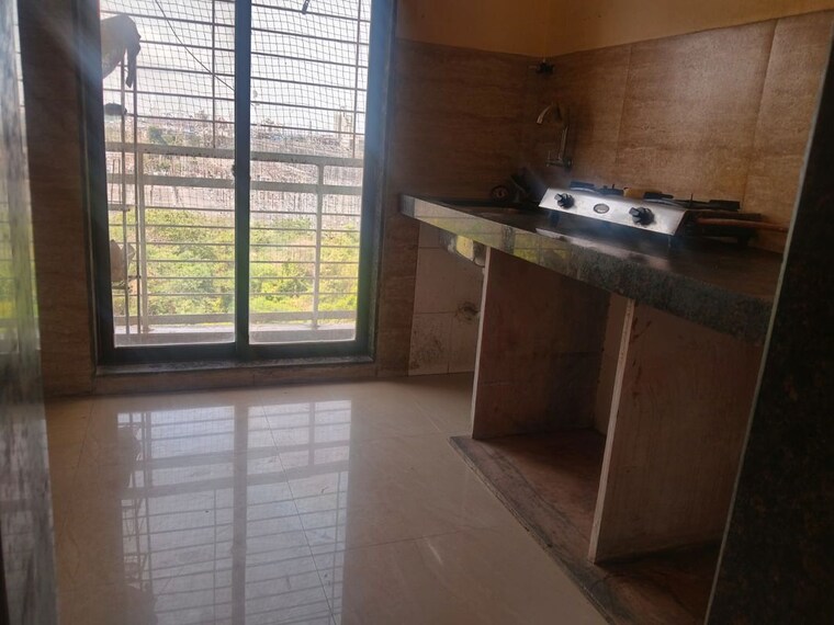 Kitchen, saha-alpine 1 Bedroom 650 Sq.Ft. Apartment In Kharghar Navi Mumbai 10426998