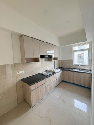 Kitchen in 2.5 BHK Apartment at Smart World Orchard, Sector 61 – for Rent