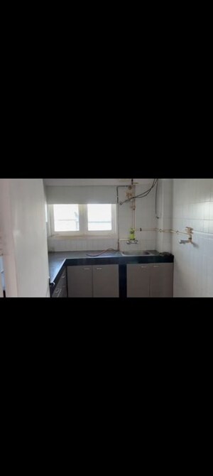 Kitchen in 3 BHK Apartment at Sanjeev Enclave, Andheri West – for Rent