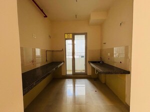 Kitchen in 2 BHK Apartment at Piramal Vaikunth, Balkum Pada – for Rent