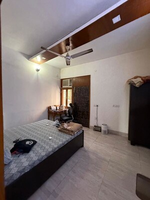 Bedroom in 2 BHK Builder Floor at Nehru Enclave – for Rent