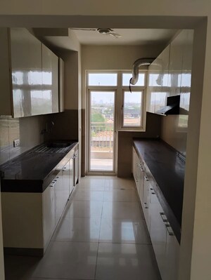 Kitchen in 3.5 BHK Apartment at Godrej Meridien, Sector 106 – for Rent