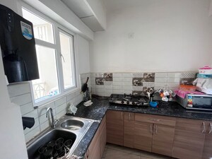 Kitchen in 2 BHK Apartment at Gaur City 2 - 16th Avenue, Sector 16c Greater Noida – for Rent