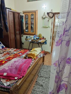 Bedroom in 1.5 BHK Builder Floor at Amar Colony – for Rent