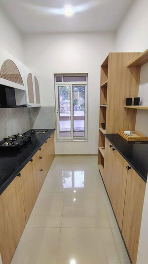 Kitchen in 2 BHK Apartment at Puranik Rumah Bali, Ghodbunder Road – for Sale