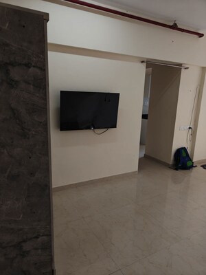 Living Room in 1 BHK Apartment at Ruparel Elara, Kandivali West – for Rent