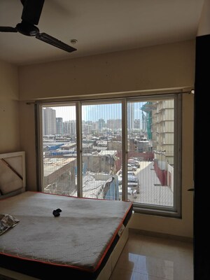 Bedroom in 1 BHK Apartment at Ruparel Elara, Kandivali West – for Rent