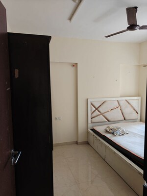 Bedroom in 1 BHK Apartment at Ruparel Elara, Kandivali West – for Rent