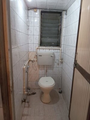 Bathroom in 1 BHK Apartment at Nav Sahyog CHS, Mahim – for Rent
