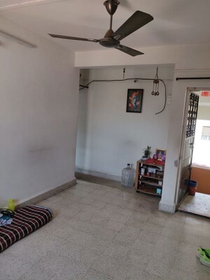 Living Room in 1 BHK Apartment at Shantiban CHS, Kothrud – for Rent