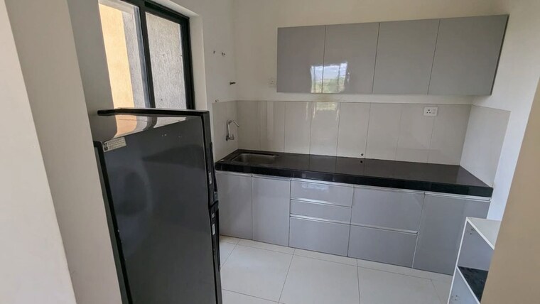 Kitchen, shapoorji-pallonji-joyville-hinjewadi 2 Bedroom 780 Sq.Ft. Apartment In Hinjewadi Pune 10429639