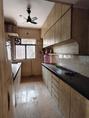 Kitchen in 2 BHK Apartment at Arpan Darpan CHS, Goregaon East – for Rent