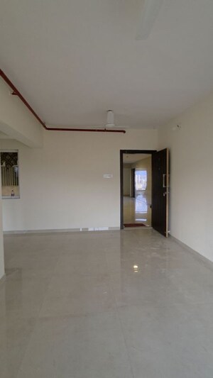 Living Room in 2 BHK Apartment at Shree Tirupati STG Signature Residency, Patlipada – for Rent