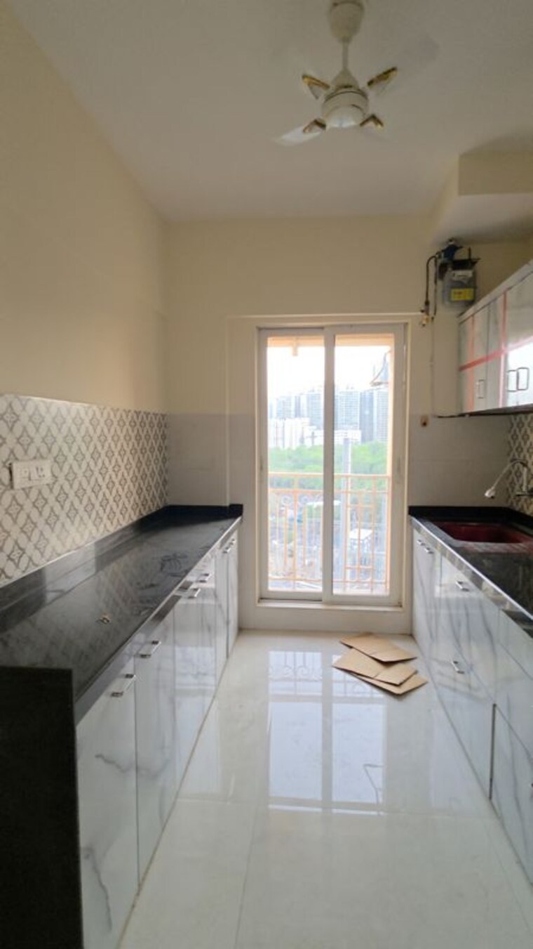 Kitchen, shree-tirupati-stg-signature-residency 2 Bedroom 850 Sq.Ft. Apartment In Patlipada Thane 10430134