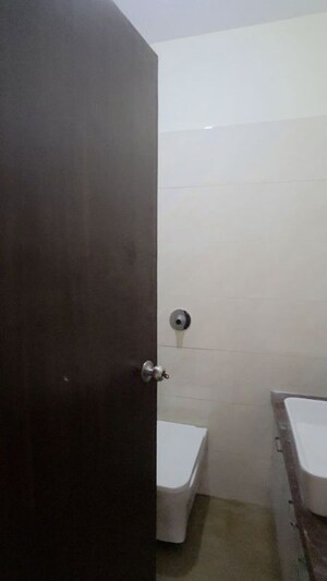 Bathroom in 2 BHK Apartment at Shree Tirupati STG Signature Residency, Patlipada – for Rent