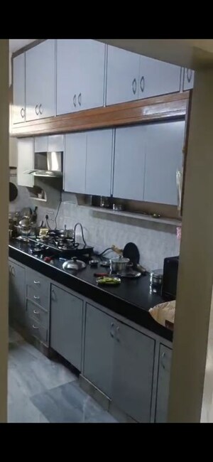 Kitchen in 3 BHK Apartment at Samridhi CGHS Apartments, Sector 21c – for Sale
