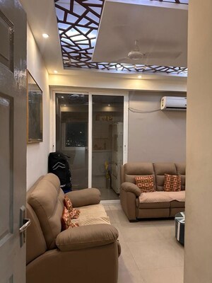 Living Room in 3 BHK Apartment at Aims Golf City, Sector 75 – for Rent