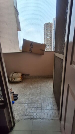 Living Room in 2.5 BHK Apartment at Aims Golf City, Sector 75 – for Rent
