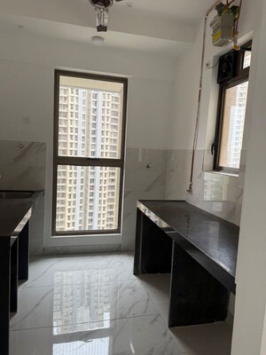 Kitchen in 2 BHK Apartment at Mahavir Kalpavruksha, Ghodbunder Road – for Sale