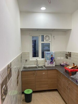 Kitchen in 2 BHK Apartment at Gaur 14th Avenue High Street, Sector 16c Greater Noida – for Rent