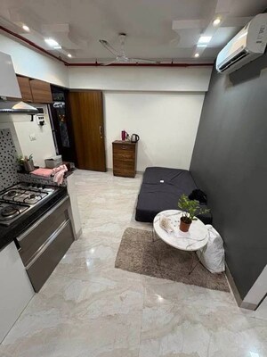 Living Room in 2 BHK Apartment at Platinum Tower 7, Andheri West – for Rent