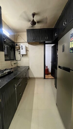 Kitchen in 2 BHK Apartment at Wadgaon Sheri – for Rent