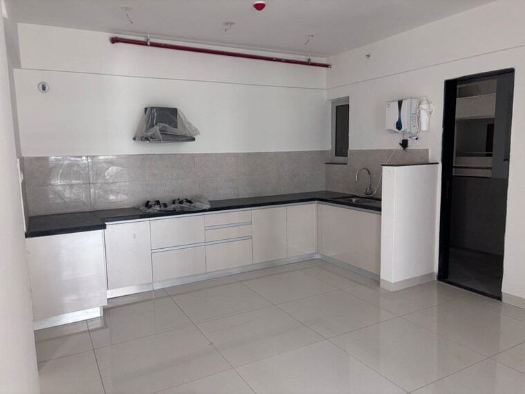 Kitchen, gera-planet-of-joy 2 Bedroom 1000 Sq.Ft. Apartment In Kharadi Pune 10430334