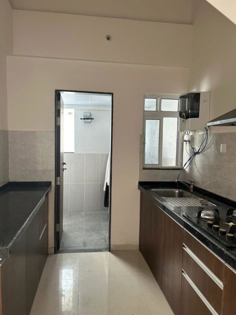 Kitchen, gera-world-of-joy 2.5 Bedroom 1100 Sq.Ft. Apartment In Kharadi Pune 10431083