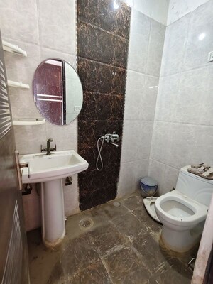 Bathroom in 2 BHK Apartment at Raj Nagar Extension – for Sale