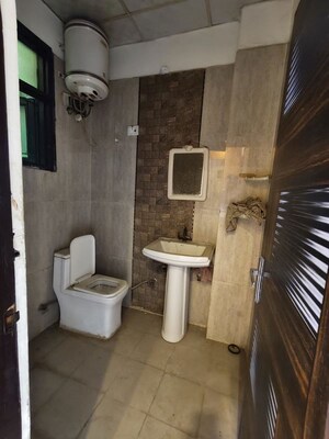 Bathroom in 2 BHK Apartment at Raj Nagar Extension – for Sale