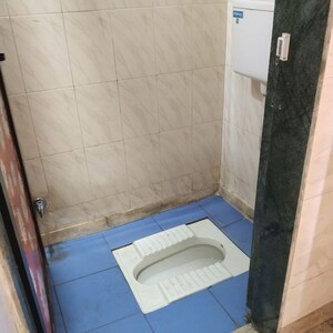 Bathroom in 1 BHK Apartment at Atharva CHS, Khanda Colony – for Rent