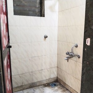 Bathroom in 1 BHK Apartment at Atharva CHS, Khanda Colony – for Rent