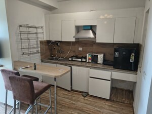 Kitchen in Studio Apartment at Nimbus The Golden Palm, Sector 168 – for Rent