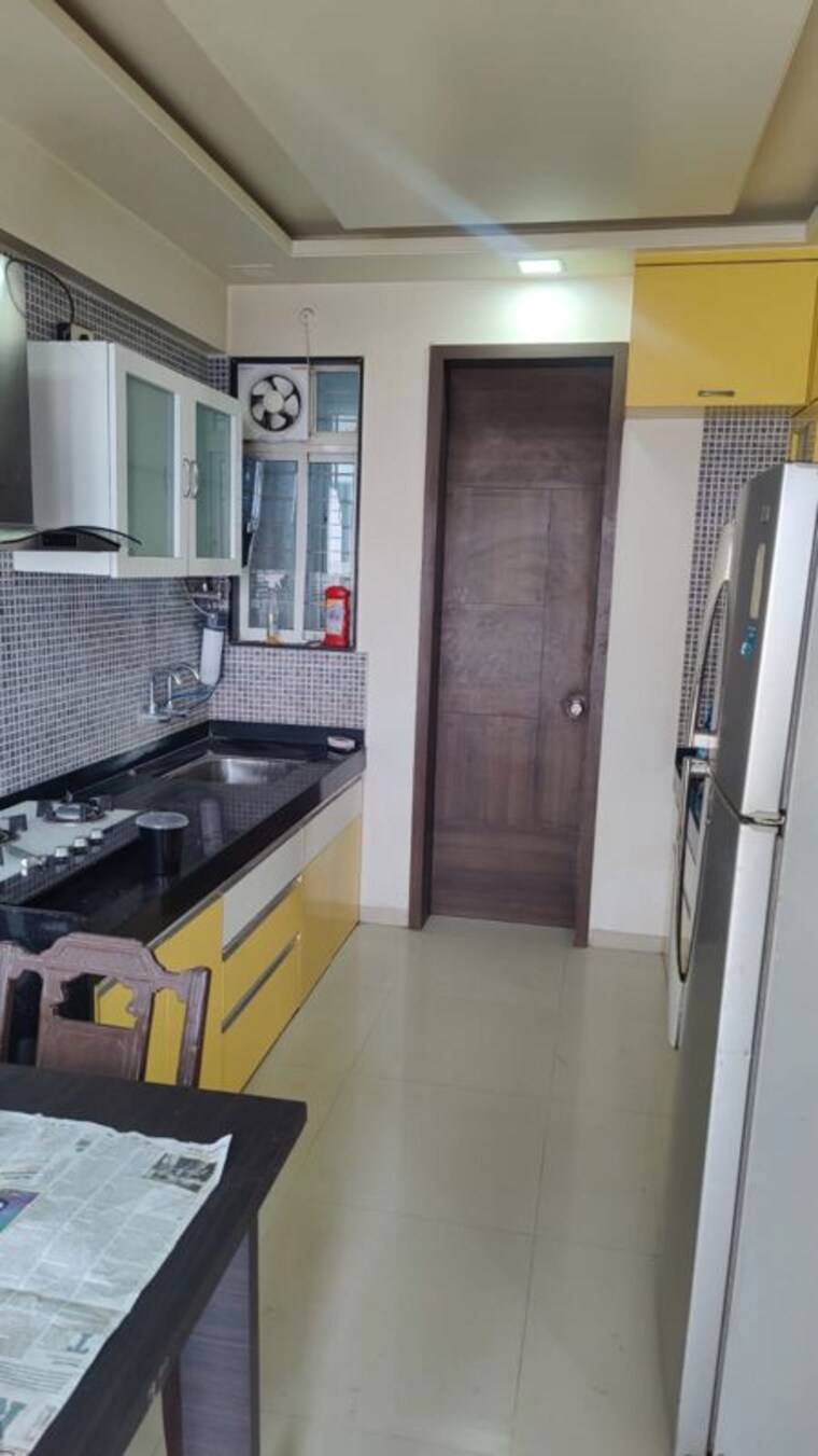 Kitchen, gagan-micasaa 2 Bedroom 750 Sq.Ft. Apartment In Wagholi Pune 10433379