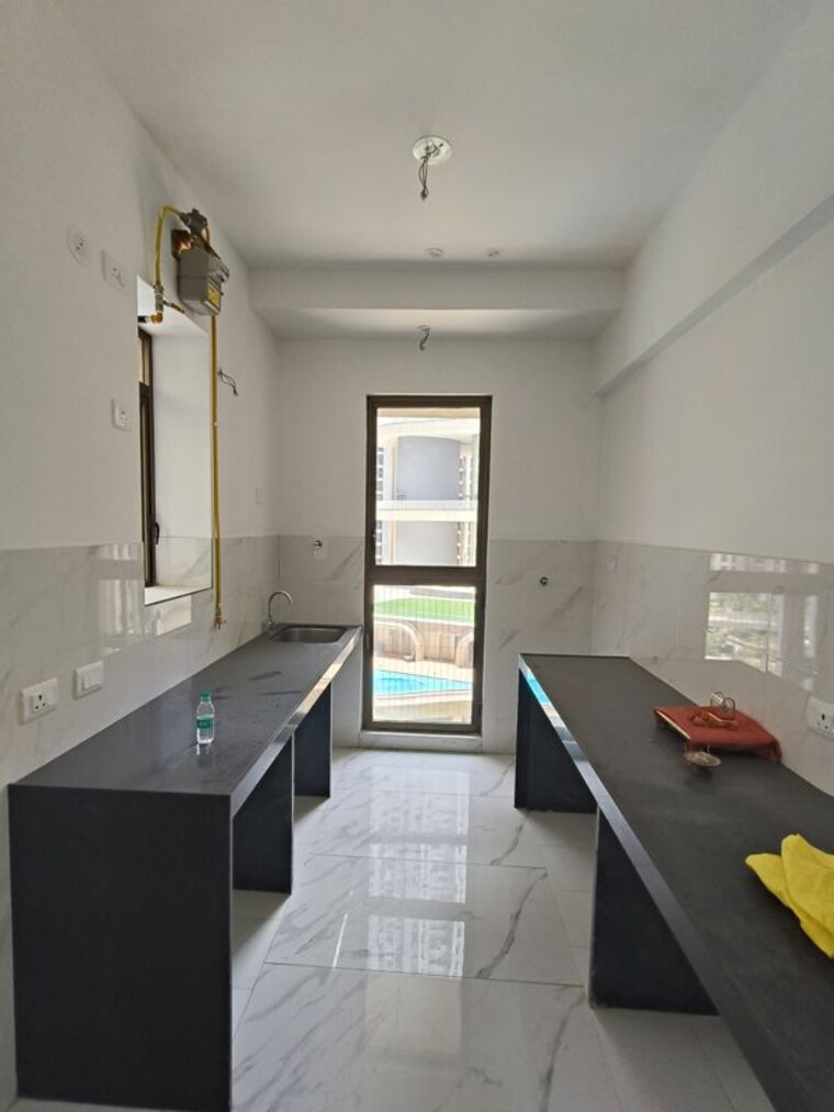 Kitchen, raymond-ten-x-habitat 2 Bedroom 656 Sq.Ft. Apartment In Pokhran Road No Two Thane 10433406