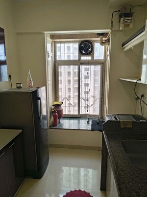 Kitchen in 2 BHK Apartment at Puranik Rumah Bali, Ghodbunder Road – for Rent