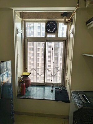 Kitchen in 2 BHK Apartment at Puranik Rumah Bali, Ghodbunder Road – for Rent