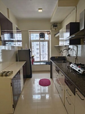 Kitchen in 2 BHK Apartment at Puranik Rumah Bali, Ghodbunder Road – for Rent