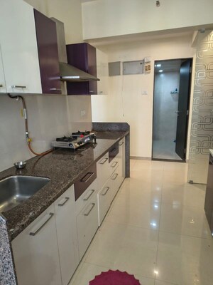 Kitchen in 2 BHK Apartment at Puranik Rumah Bali, Ghodbunder Road – for Rent