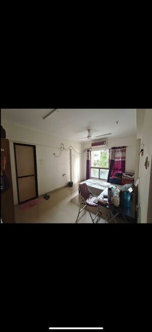 Living Room in 1 BHK Apartment at Noble Heights, Malad East – for Rent