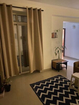 Living Room in 2 BHK Apartment at Tata Eureka Park, Sector 150 – for Sale