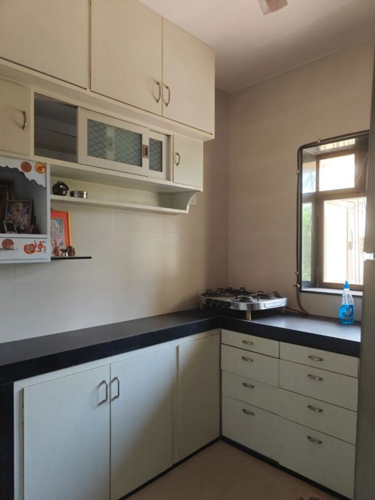 Kitchen, seven bunglow 2 Bedroom 900 Sq.Ft. Apartment In Seven Bunglow Mumbai 10435096