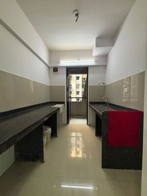 Kitchen in 1 BHK Apartment at Lodha Downtown, Dombivli East – for Rent