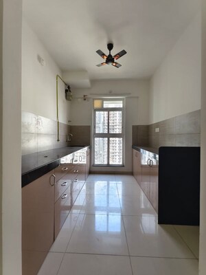 Kitchen in 2 BHK Apartment at Godrej Emerald, Ghodbunder Road – for Rent