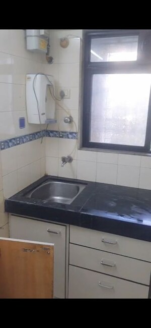 Kitchen in 2 BHK Apartment at Divya Smruthi, Malad West – for Rent