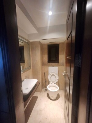 Bathroom in 4 BHK Apartment at Ambience Caitriona, Sector 24 – for Sale