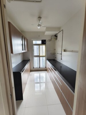 Kitchen in 3 BHK Apartment at Godrej Emerald, Ghodbunder Road – for Rent