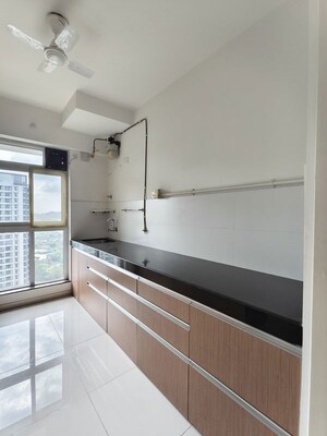 Kitchen in 3 BHK Apartment at Godrej Emerald, Ghodbunder Road – for Rent