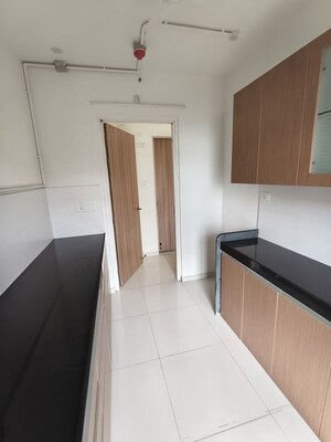 Kitchen in 3 BHK Apartment at Godrej Emerald, Ghodbunder Road – for Rent