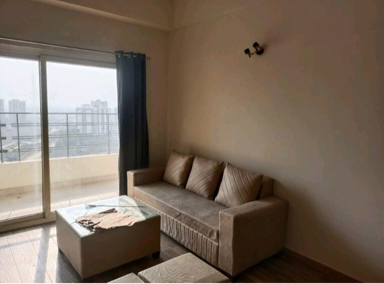 Living Room, paramount-golf-foreste-apartments 1 Bedroom 880 Sq.Ft. Apartment In Zeta I Greater Noida Greater Noida 10436962